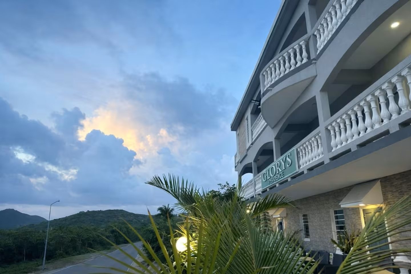 Glory's Residence exterior at sunset